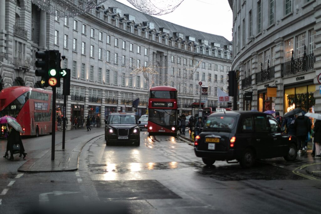 Busy road with a London bus stop, served by Durham City Cabs, one of leading taxis in durham city