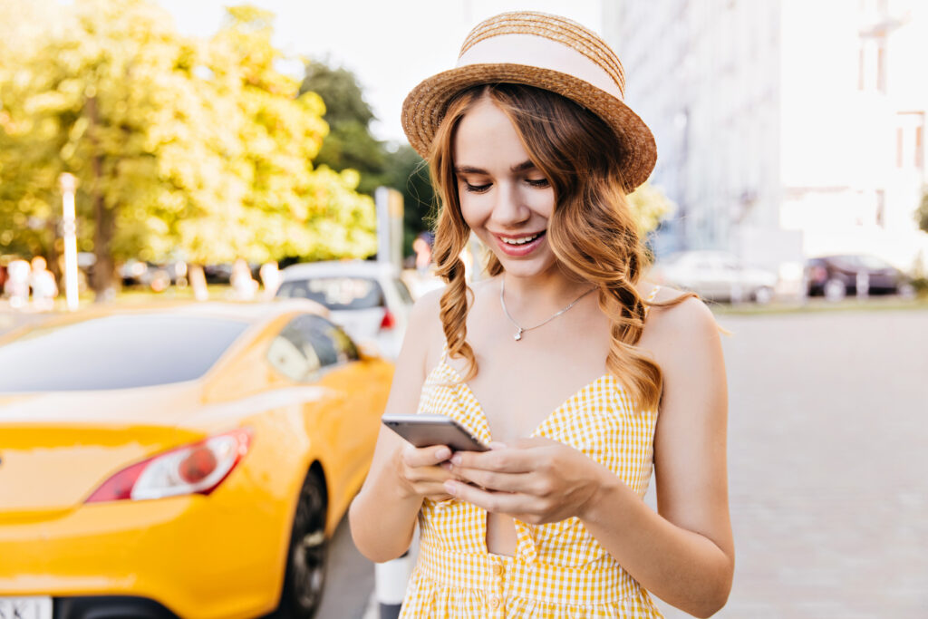 girl calling for taxi while standing in durham